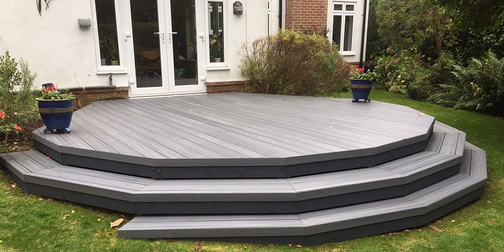 Composite decking steps installed in a modern UK garden