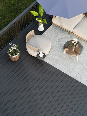 Charcoal and anthracite dual tone co extrusion composite decking board with capped surface