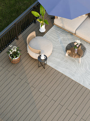 Cement grey and natural co extrusion composite decking board showing dual tone wood-effect finish